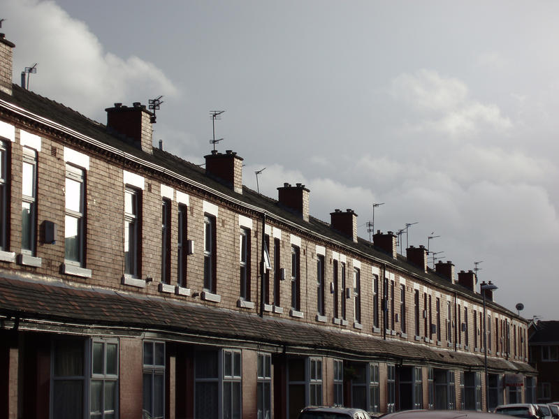 a row of red brick terraced houses in manchester uk - not property relased