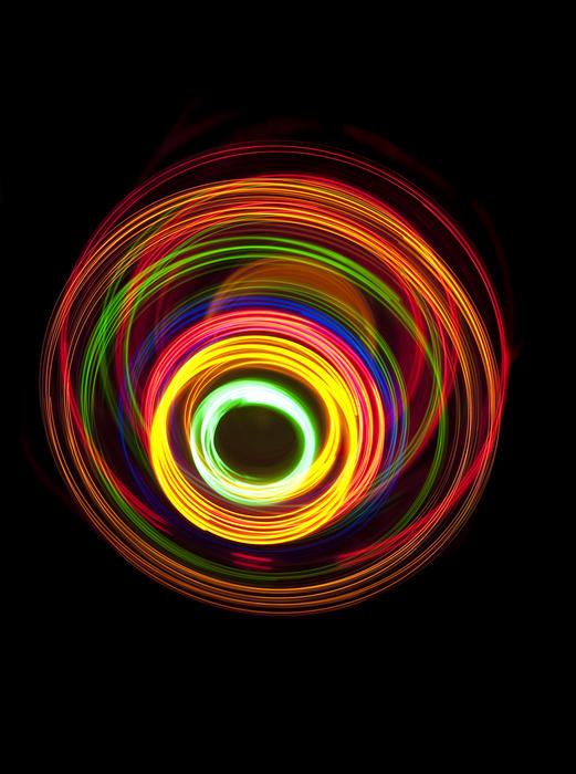 colouful overlapping circular pattern of 'light trails'