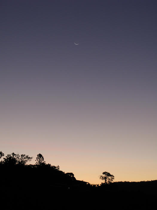 silhouette of a landscape under a twilight sky