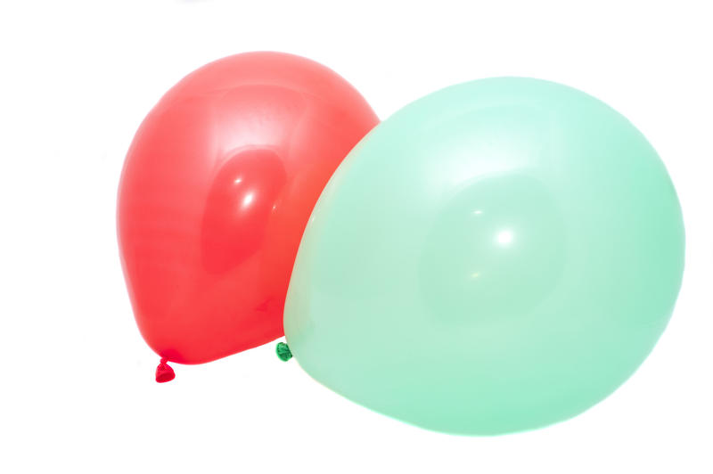 a red and green inflated party baloon on a white background