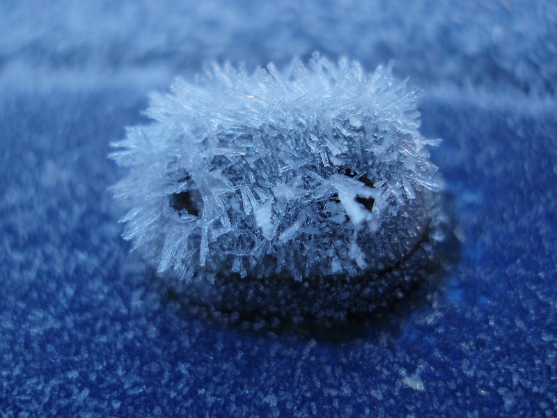 washer nozzle on a car bonnet frozen up on a winter morning