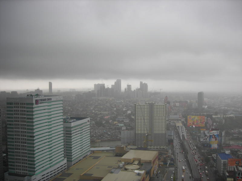 <p>Storm clouds over a city skyline</p>