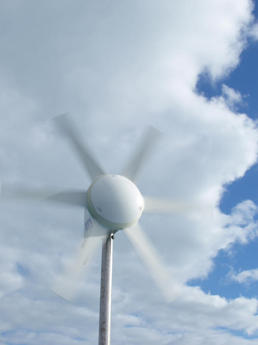 a small wind turbine producing sustainable energy