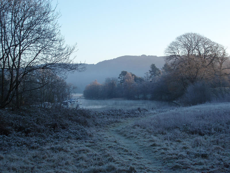 lake side meadow covered in frost on a cold morning