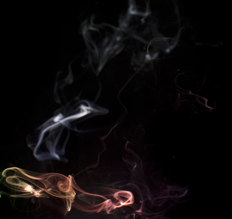 colorful defuse smoke vapours on black
