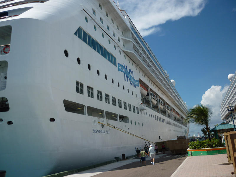 a large Caribbeancruise ship docked at the quayside : editorial use