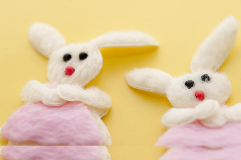 Easter Girl Bunnies in textured soft felt fabric with little pink clothing on a yellow background