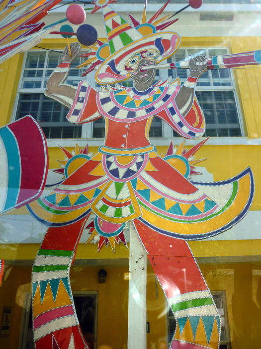 a decorative clown image on the side of a building