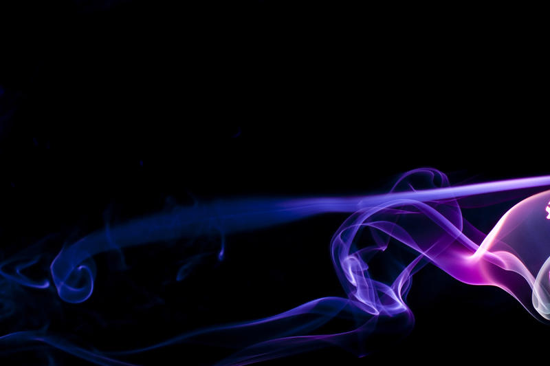 colorful pattern of purple and pink glowing smoke