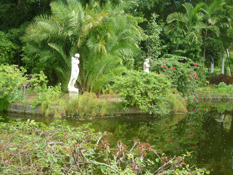 classical statues and a pond