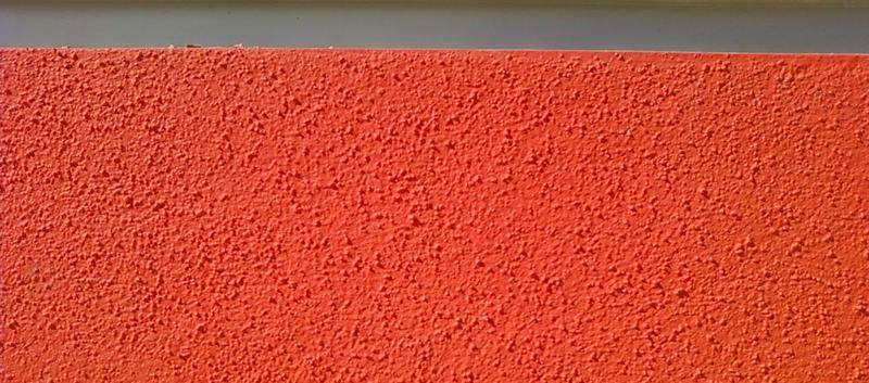 <p>Orange stucco background with gray strip </p>