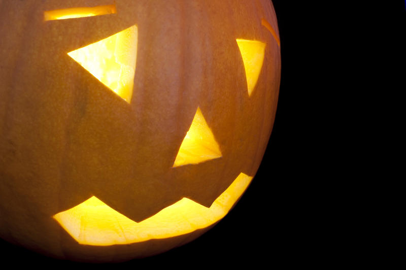close up on the face of a halloween pumpkin lantern