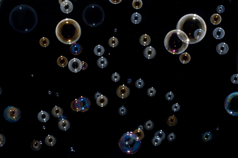 a mass of bubbles of different sizes and at different distances from the camera