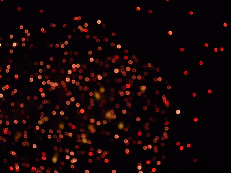 red out of focus firework sparkles