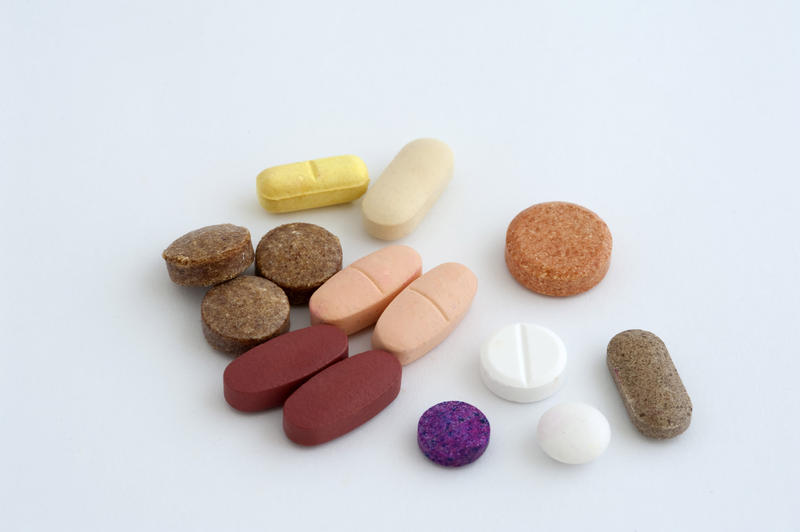 a selection of pills on a white background