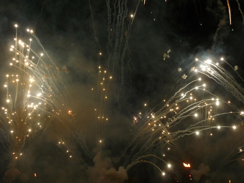 smoke trails created by a display of firework rockets