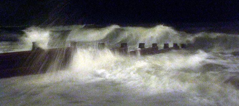 <p>A grainly and moody image of the ocean in a storm</p>