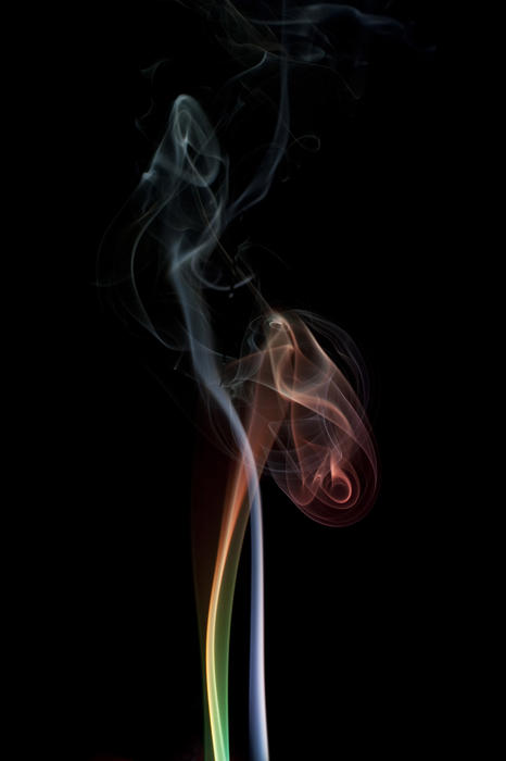 colorful swirling smoke on a black backdrop