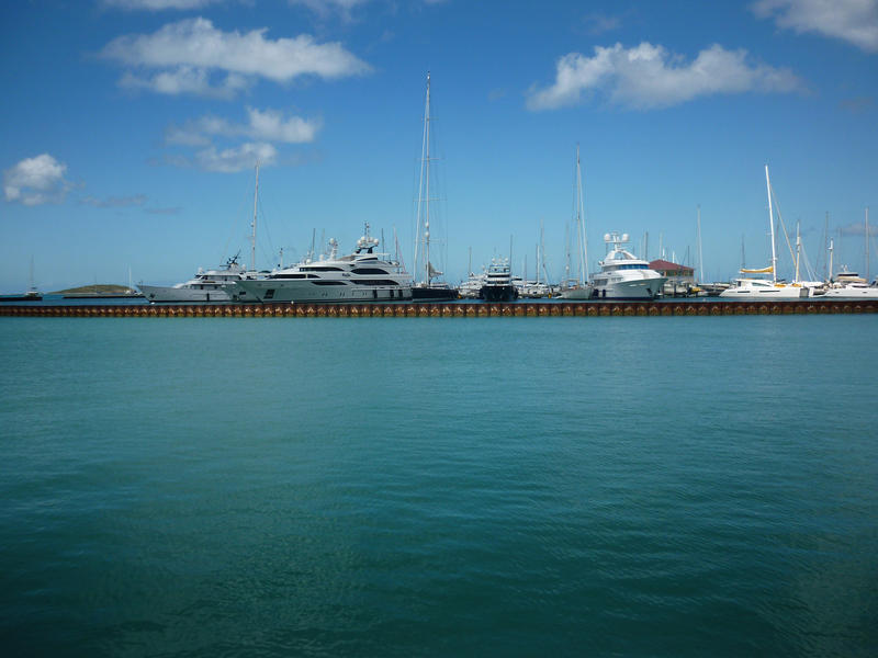 a large marina and luxury yachts on the island of st maartin