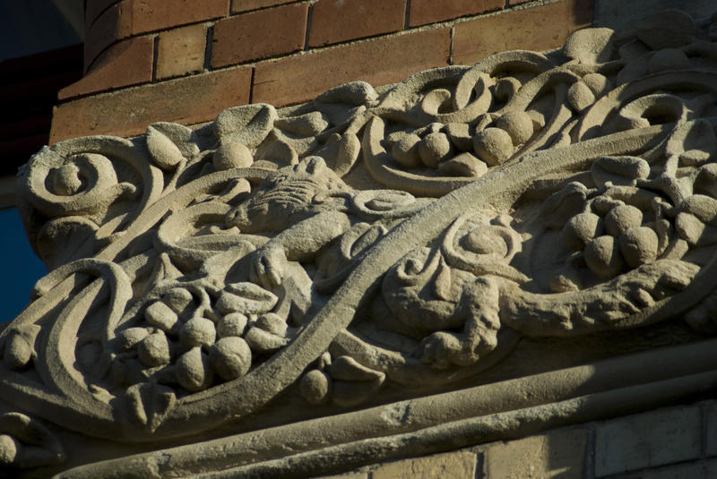 a carved stone freeze on an old building