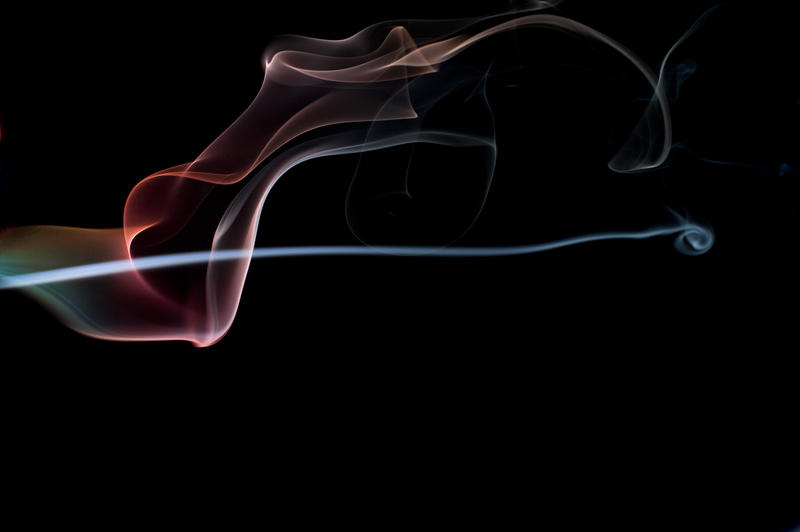 colorful pattern of defuse glowing pink and blue smoke