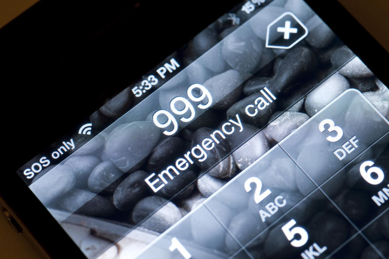 A mobile phone display making a 999 emergency call