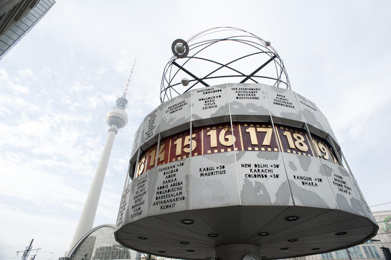 Closeup view of the cylindrical Weltzeituhr or Worldtime Clock in Alexanderplatz, Berlin whiich has 24 international time zones and is topped by an astronomical sculpture of the planets