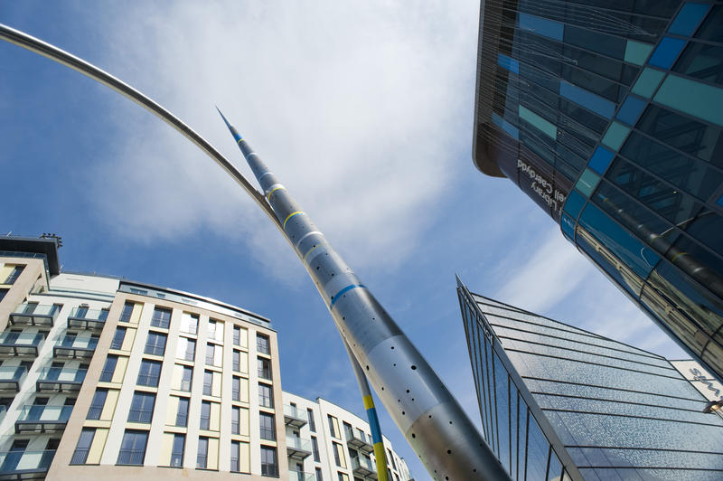 View looking up the pointed metal and enamel arrow column with part of the hoop visible on the Alliance Sculpture in Cardiff, Wales