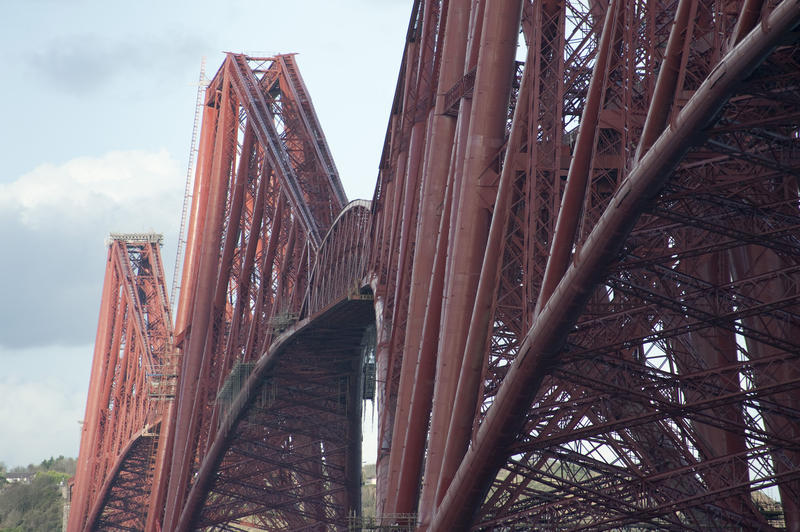 View down the length of the structure of the landmark Forth Rail Bridge which crosses the Firth of Forth in Scotland