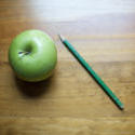 6957   Fresh green apple and a pencil