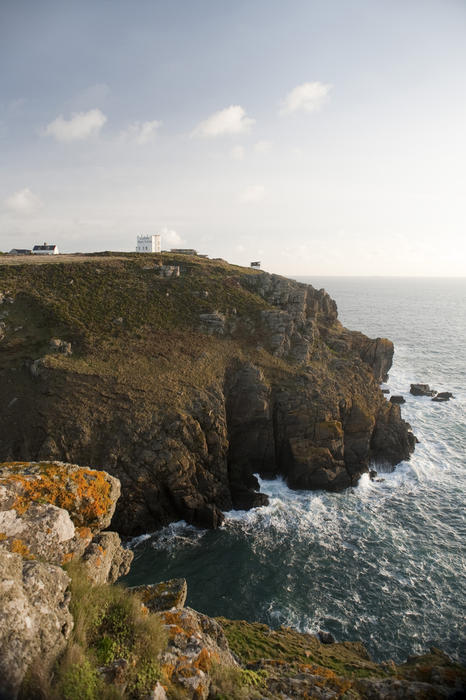 Scenic view of the rocky headland at Bass Point with the historical Lloyds Signal House visible high on the cliff