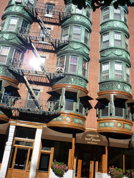 Architectural design background of the exterior facade of a building in Boston with rows of bay windows