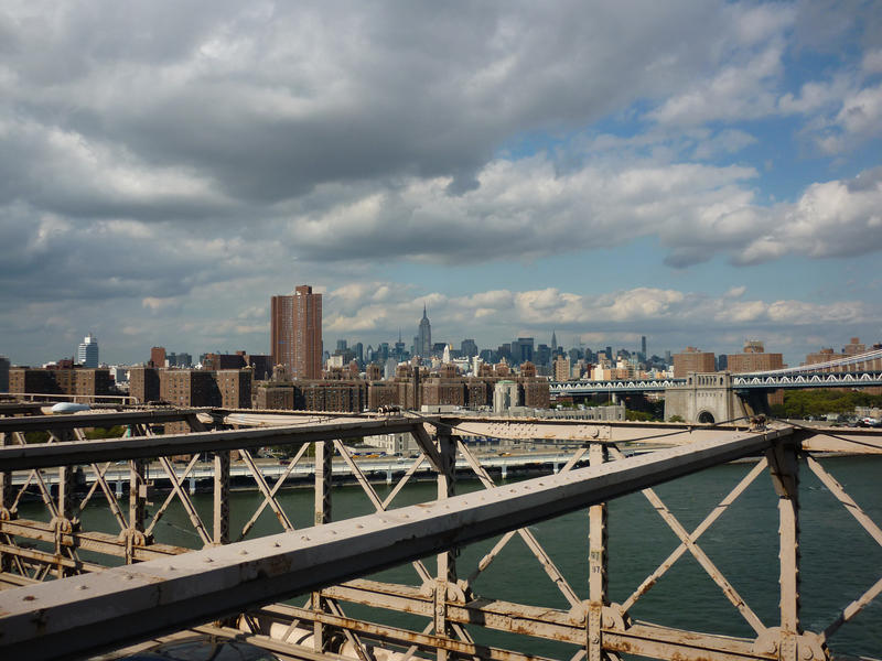 Manhattan, New York, as seen from Brooklyn Bridge with a section of the structural steelwork of the bridge in the foreground