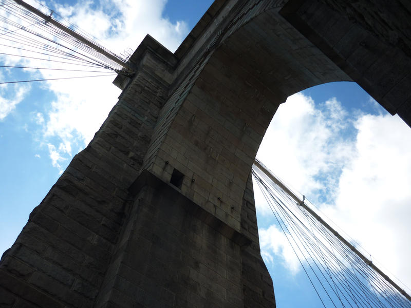 Looking up under an arch on the iconic Brooklyn bridge the oldest suspension bridge in New York