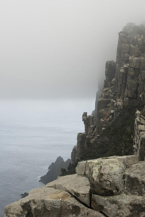 spectacular rugged coastline of cape pillar pictured on a misty day