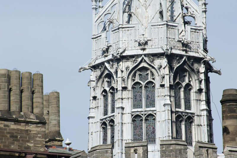 Detail of the Gothic Tower in Cardiff Castle showing the beautiful arched stone window facades above the crenellations