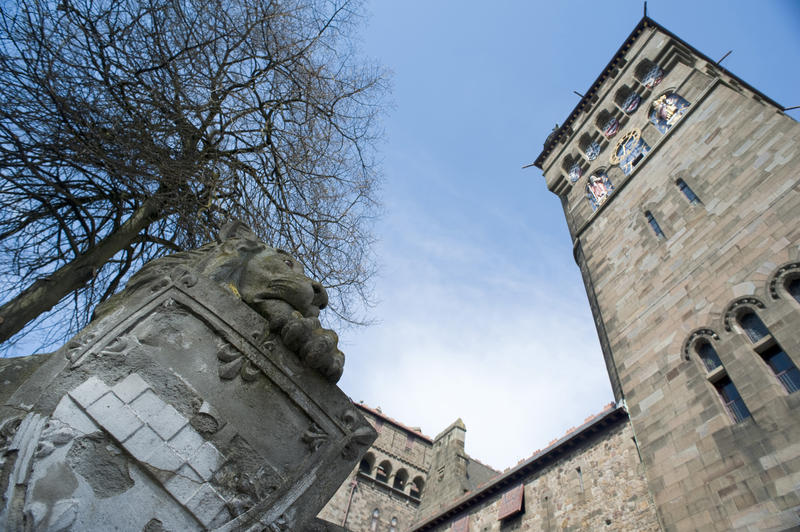 The stone sculpture of the lion with its heraldic shield on top of the Cardiff Castle Animal Wall at Cardiff castle in Wales