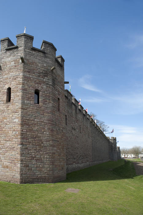 View down the length of the historical crenallated stone walls surrounding Cardiff Castle