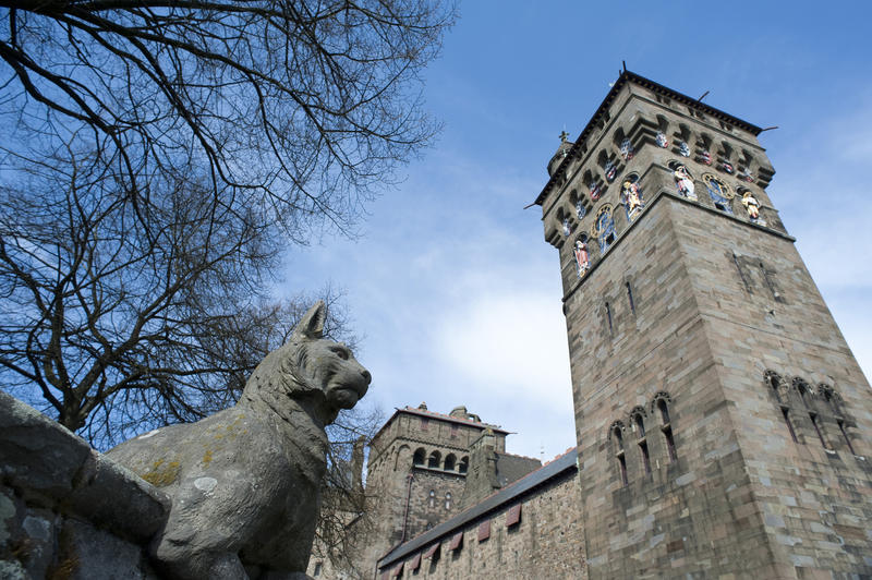 cardiff castle clock tower designed by William Burges; and a sculpture on the animal wall in the foreground