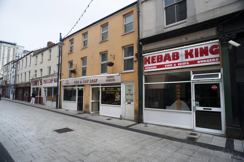 View of shops in Caroline Street, otherwise known as Chippy Lane, in Cardiff city centre, Wales