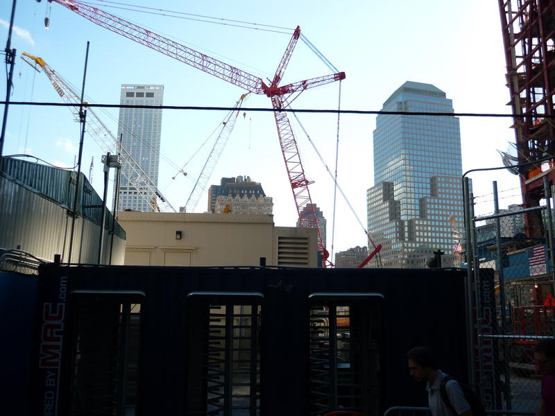 Large steel urban crane on the skyline in a city undertaking construction on skyscraper buildings