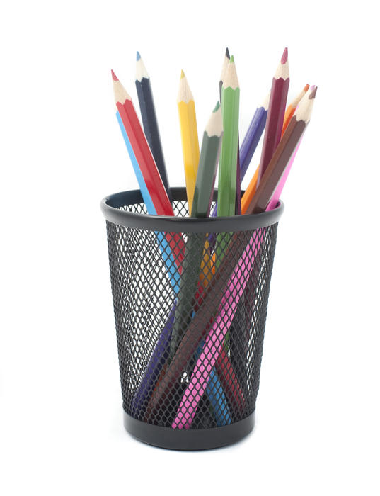 Colouring pencils in a metal container desk tidy ready for colouring in, drawing or handicraft