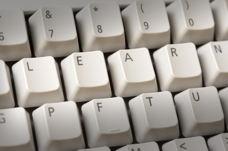 The alphabet letters LEARN on the keys of a computer keyboard conceptual of online learning and education