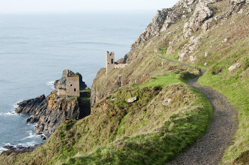 Crown Mines engine house ruins perched on a cliff overlooking the Atlantic ocean and its undersea shafts, now part of the Cornwall and West Devon Mining Landscape World Heritage site