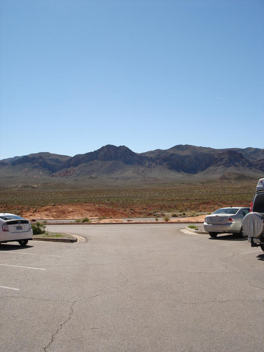 cars parked on a carpak built in the california desert