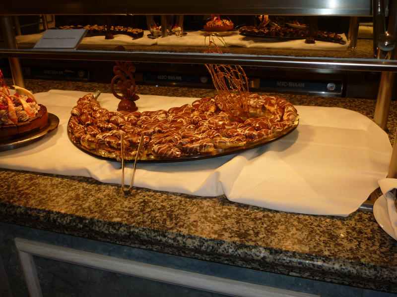 Delicious assortment of pastries and cakes on display in a dessert buffet