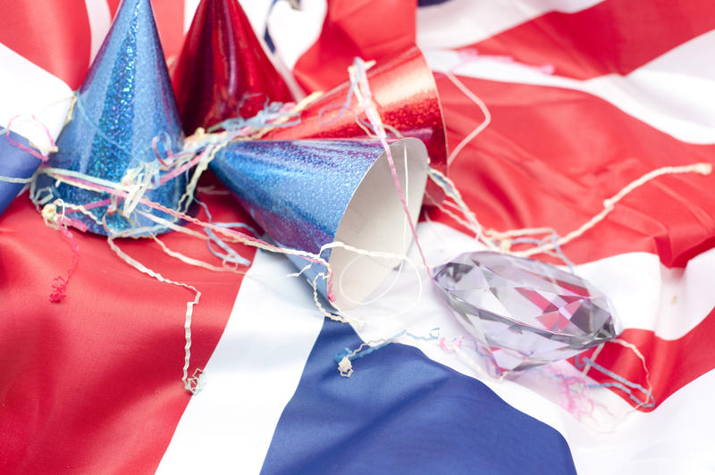 background image, a union flag, party hats and a large diamond representing the queens diamond jubilee celebrations