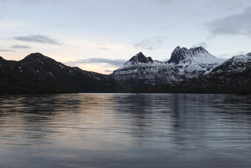 cradle and surrounding mountains framed with the waters of dove lake