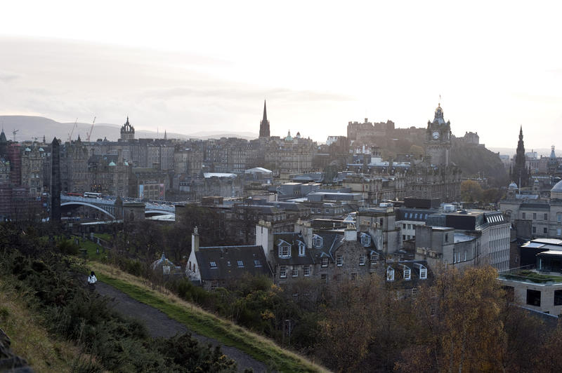 View across a misty Edinburgh towards the Edinburgh Castle and Rock on the skyline
