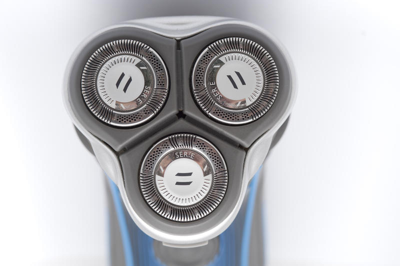 Electric shaver detail with a closeup of the head and blades